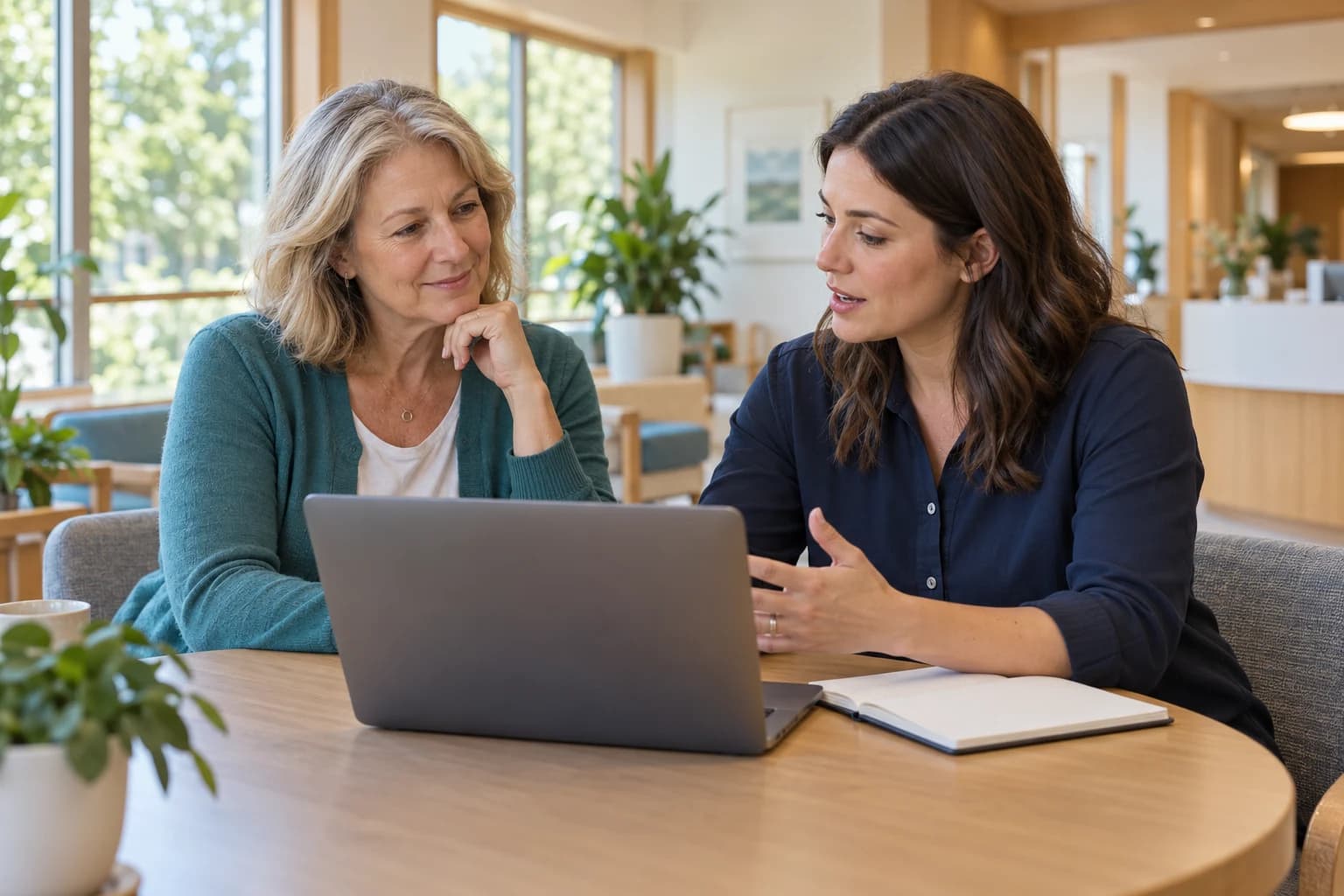 A service manager and technology specialist planning together